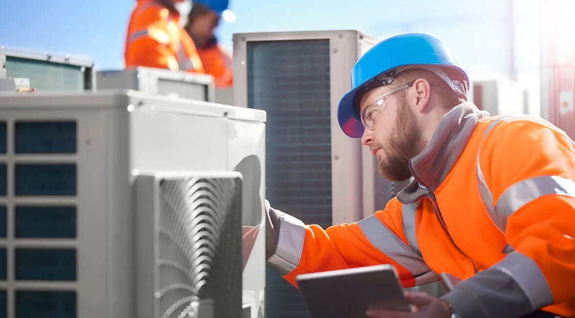 Commercial Heating Technician Inspecting Unit