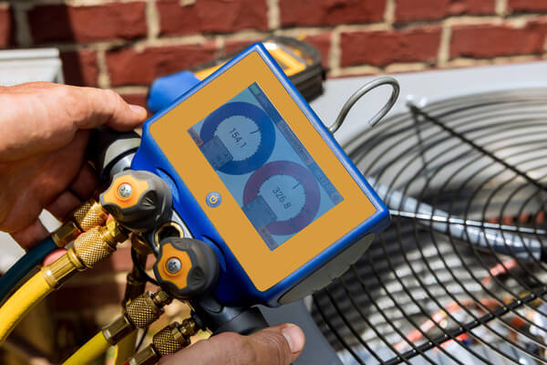 Air conditioner check service the technician repairing outdoor air conditioner unit