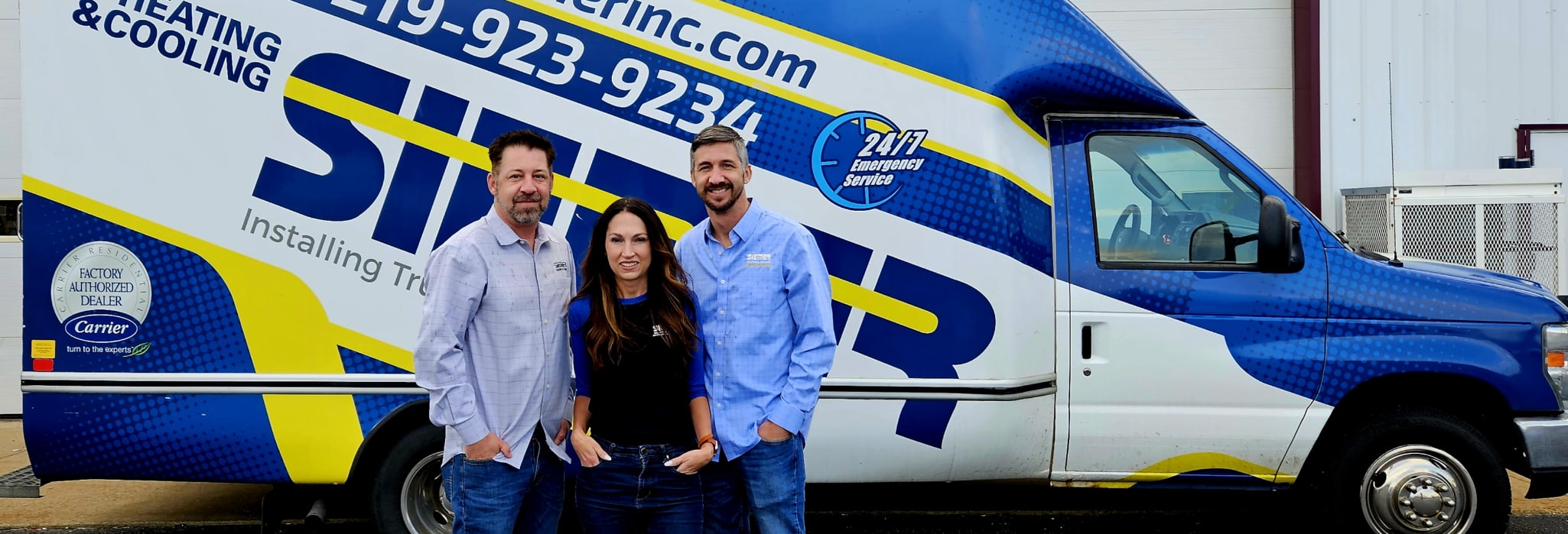 Ashley Siemer, Allen Siemer, and Paul Siemer standing in front of a Siemer truck.